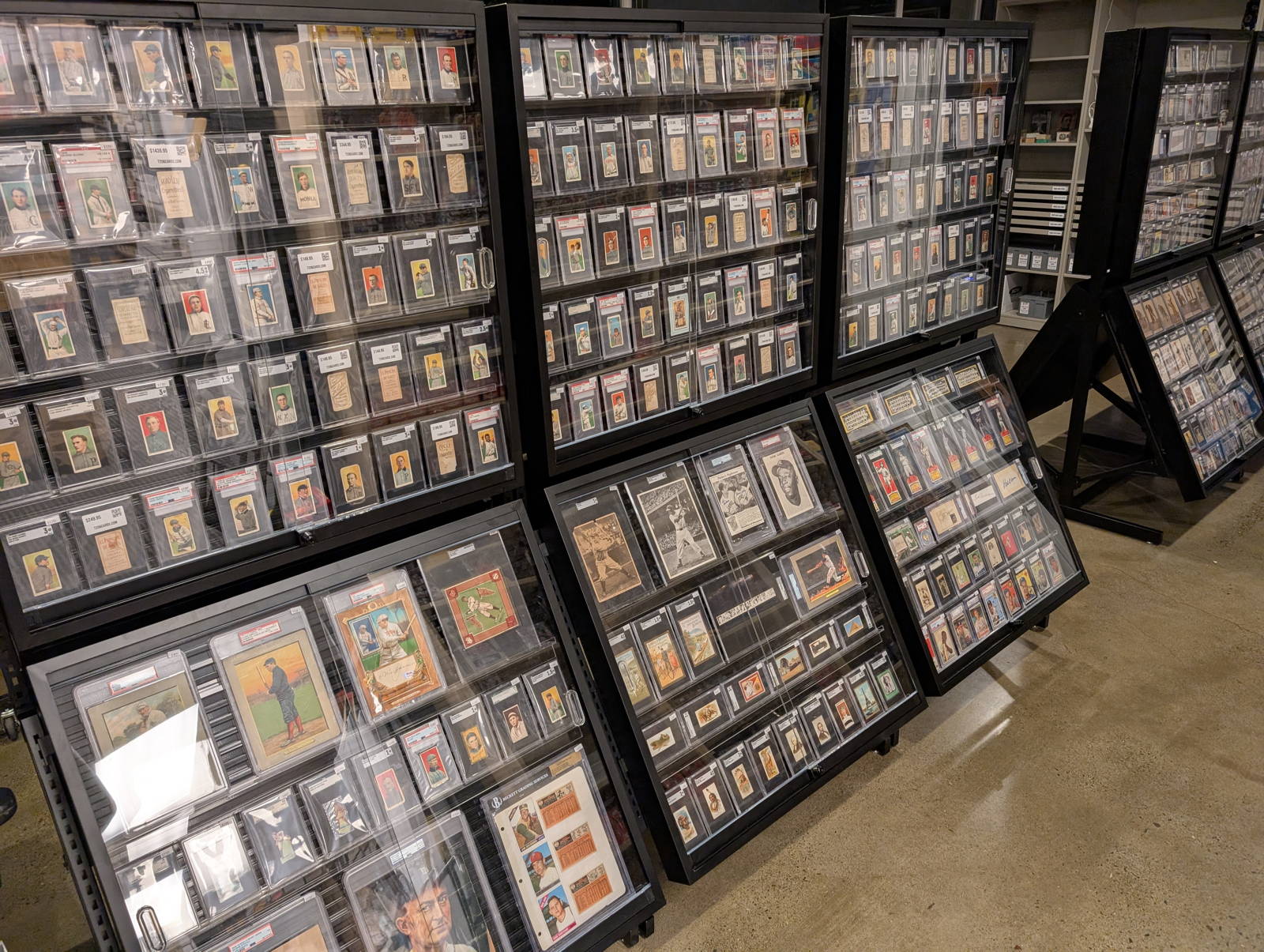 Display cases of graded vintage cards at the T206 Cards shop