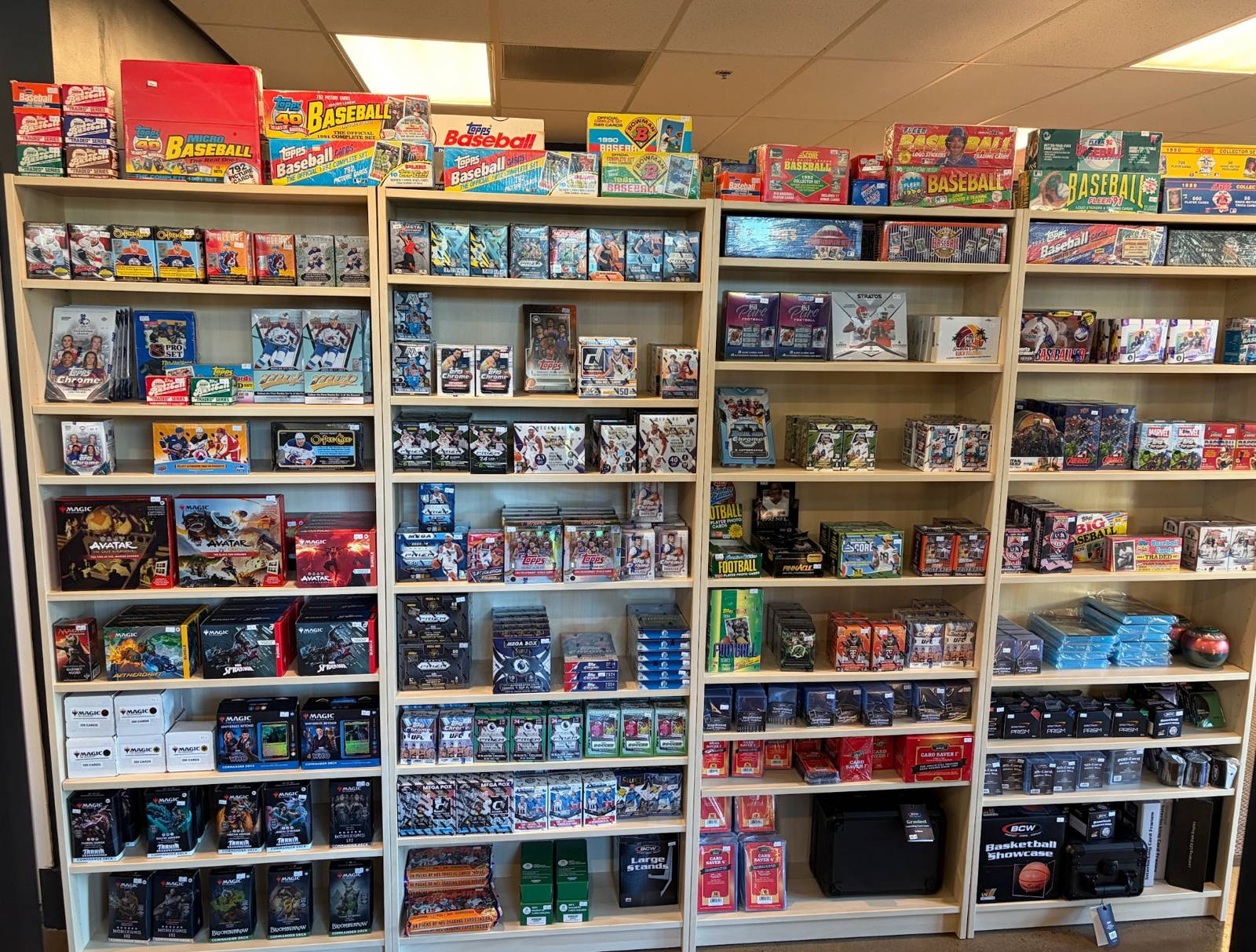 Shelves of sealed wax boxes and current sets